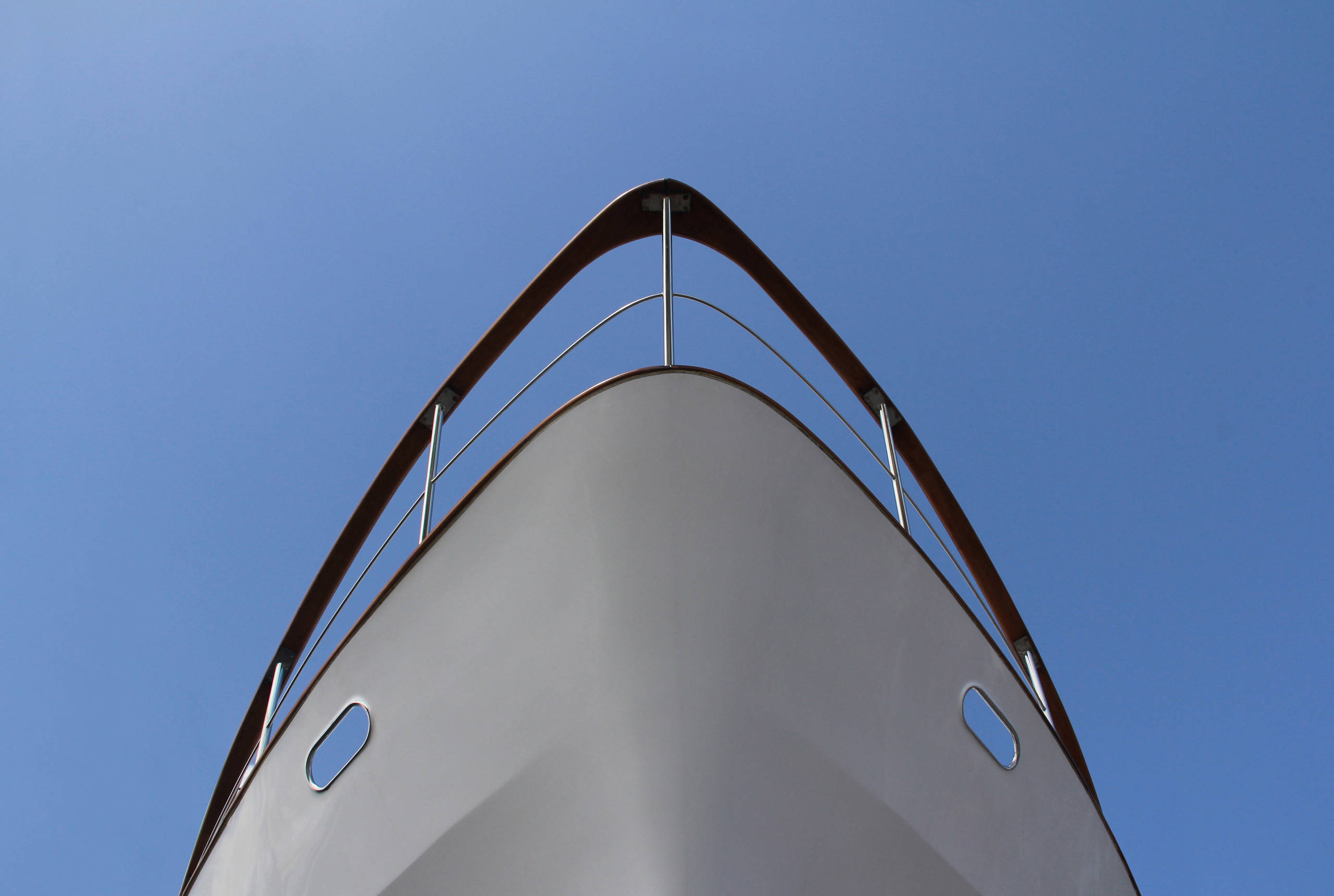 Ships prow seem from below against blue sky