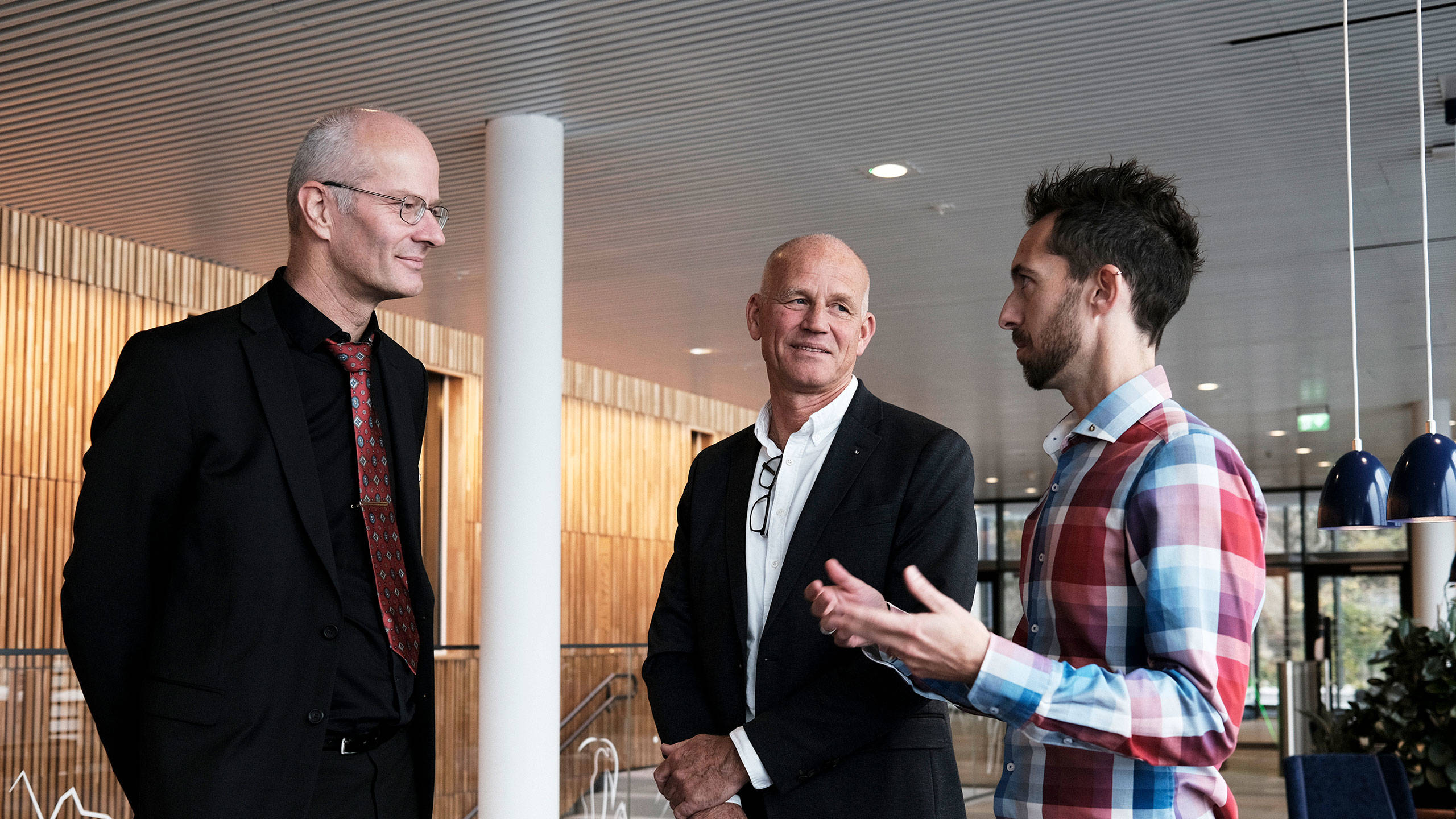 Three people attending the collaboration event